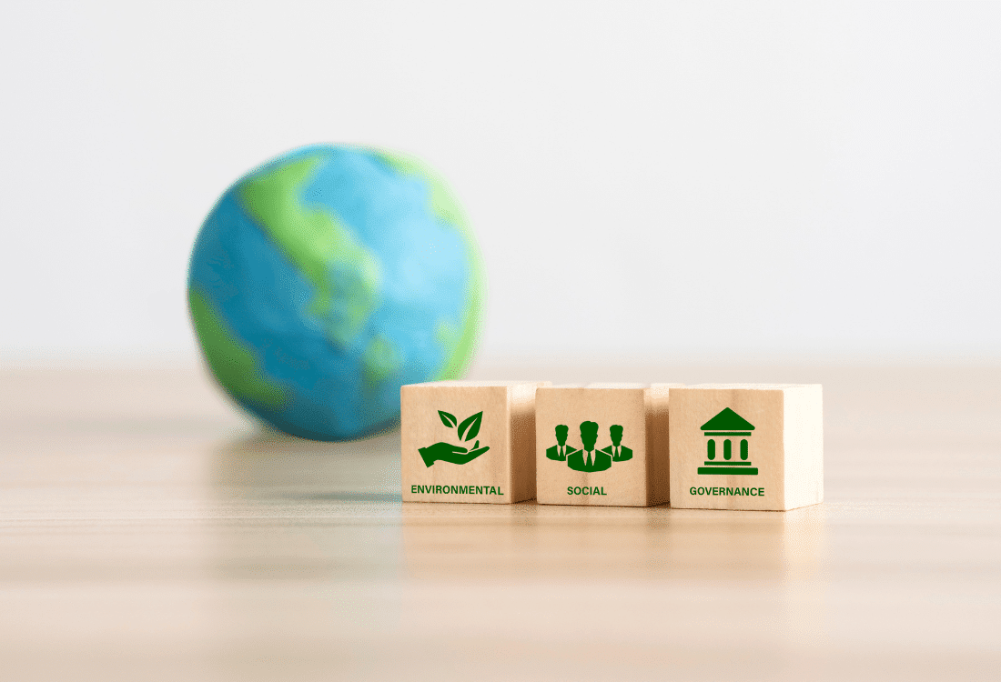 Wooden block with printed symbols representing sustainability, people, industry, reflecting the potential implications of the upcoming Procurement Act.