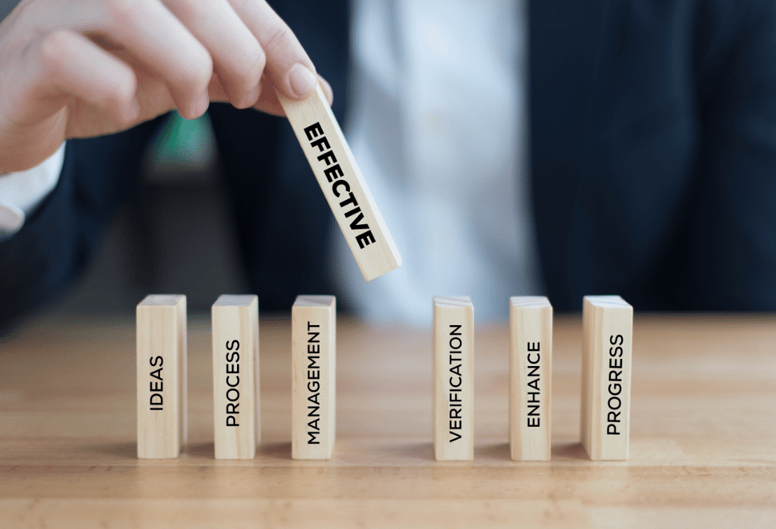 Businessman emphasising the importance of effective supply chain management with blocks